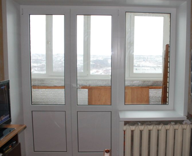 Porte de balcon double avec insert aveugle en bas